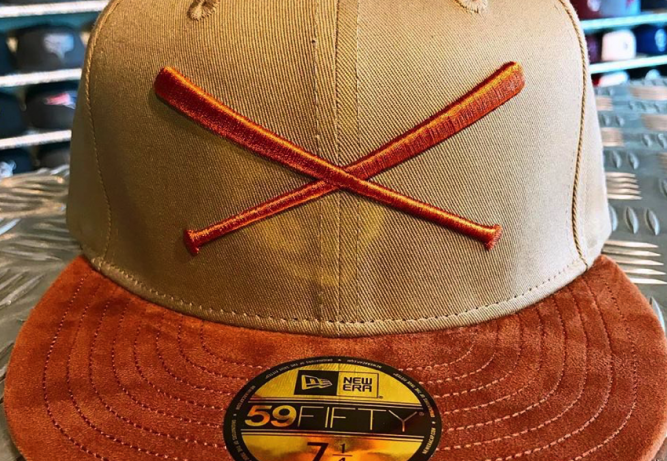 new-era-justfitteds-crossed-bats-logo-sude-sample
